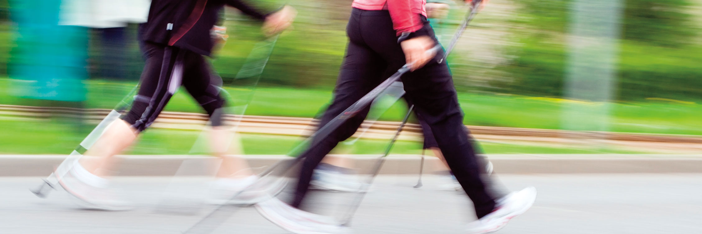 Two people walking fast for exercise